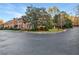 Traditional brick townhomes in a desirable location with mature landscaping and a circular drive at 3456 Paces Nw Pl, Atlanta, GA 30327