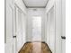 Bright hallway with hardwood floors and built-in storage at 3456 Paces Nw Pl, Atlanta, GA 30327