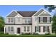 Two-story house with gray siding, dark shutters, and a grassy lawn at 189 Haverling Pass, Hampton, GA 30228