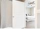 Bathroom with shower and view into bedroom at 2626 Peachtree Nw Rd # 706, Atlanta, GA 30305