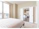 Spacious bedroom with view into modern kitchen at 2626 Peachtree Nw Rd # 706, Atlanta, GA 30305
