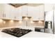 Modern kitchen with white cabinets and stainless steel appliances at 2626 Peachtree Nw Rd # 706, Atlanta, GA 30305