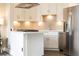 Modern kitchen with white cabinets and stainless steel appliances at 2626 Peachtree Nw Rd # 706, Atlanta, GA 30305