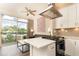 Open concept kitchen with island and stainless steel appliances at 2626 Peachtree Nw Rd # 706, Atlanta, GA 30305