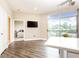 Spacious living room with sliding doors leading to balcony at 2626 Peachtree Nw Rd # 706, Atlanta, GA 30305
