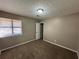 Spacious bedroom with neutral walls and carpet at 6729 Timbers East Dr, Lithonia, GA 30058