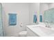 Bright bathroom featuring a white vanity, modern fixtures, and a framed mirror at 79 Dew Drop Ln, Dallas, GA 30157