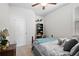 Inviting bedroom with a ceiling fan, comfortable queen-sized bed, and ample natural light at 79 Dew Drop Ln, Dallas, GA 30157