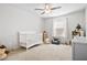 Cozy bedroom with a white crib, neutral carpet, and plenty of natural light at 79 Dew Drop Ln, Dallas, GA 30157