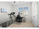 Bright room with a treadmill, desk, and ample space, perfect for a home office or gym at 79 Dew Drop Ln, Dallas, GA 30157