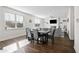 Open-concept living and dining area with hardwood floors and plenty of natural light at 79 Dew Drop Ln, Dallas, GA 30157