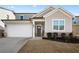 Two-story house with gray siding, white trim, and a brown front door at 79 Dew Drop Ln, Dallas, GA 30157