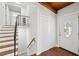 Bright entryway with staircase, coat closet, and hardwood floors at 4079 Navajo Ne Trl, Brookhaven, GA 30319