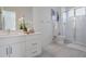 Modern bathroom with white vanity, shower, and white tile flooring at 525 Parkway Ne Dr # 320, Atlanta, GA 30308