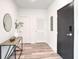 Modern entryway with dark door and wood-look floors at 525 Parkway Ne Dr # 320, Atlanta, GA 30308