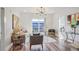 Bright living room features wood floors, a comfy sofa, and sliding glass doors to a balcony at 525 Parkway Ne Dr # 320, Atlanta, GA 30308