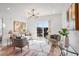 Bright living room with hardwood floors, comfy seating, and access to a balcony at 525 Parkway Ne Dr # 320, Atlanta, GA 30308