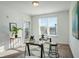 Bright office with glass desk, window, and patterned rug at 525 Parkway Ne Dr # 320, Atlanta, GA 30308