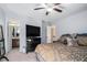 Main bedroom with ensuite bathroom and large TV at 539 Rokeby Dr, Woodstock, GA 30188