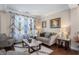 Living room with hardwood floors and neutral-toned furniture at 539 Rokeby Dr, Woodstock, GA 30188