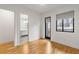 Light-filled bedroom with hardwood floors, an en-suite bathroom, and private balcony at 910 Ponce De Leon Ne Ne Ave # 3, Atlanta, GA 30306