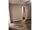 Bedroom with neutral walls, ceiling fan, carpet flooring, and an open door leading to another room at 1799 Timber Valley Se Way, Smyrna, GA 30080