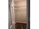 A walk-in closet with metal shelving, tan walls, and clean carpeting at 1799 Timber Valley Se Way, Smyrna, GA 30080