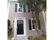 Charming townhome featuring a black front door, two stories, and a well-maintained exterior at 1799 Timber Valley Se Way, Smyrna, GA 30080