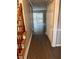 Hallway features hardwood floors, leading to a bright living area with sliding glass doors to the backyard at 1799 Timber Valley Se Way, Smyrna, GA 30080