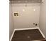 A laundry room with dark wood flooring and white trim around the base of the walls, ready for a washer and dryer at 1799 Timber Valley Se Way, Smyrna, GA 30080