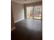 Bright living area with hardwood floors and sliding glass doors to the backyard at 1799 Timber Valley Se Way, Smyrna, GA 30080
