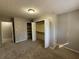 Bright bedroom with double closets and neutral carpet at 4208 Rue Saint Michel, Stone Mountain, GA 30083