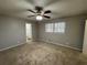Large bedroom with neutral carpeting and access to bathroom at 4208 Rue Saint Michel, Stone Mountain, GA 30083