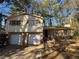 Ranch style home with two-car garage and mature trees at 4208 Rue Saint Michel, Stone Mountain, GA 30083