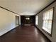 Spacious living room with hardwood floors and a brick fireplace at 4208 Rue Saint Michel, Stone Mountain, GA 30083