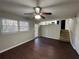 Spacious living area with hardwood floors, ceiling fan, and kitchen view at 4208 Rue Saint Michel, Stone Mountain, GA 30083