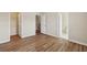 Bedroom with hardwood floors provides access to a bathroom and closet at 2159 Meadow Peak Rd, Duluth, GA 30097