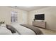 Bedroom featuring a dresser with mounted TV and a queen-size bed by the window at 2159 Meadow Peak Rd, Duluth, GA 30097