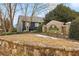 Community sign view with stone wall and landscaping on an overcast day at 2159 Meadow Peak Rd, Duluth, GA 30097