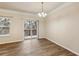 Bright dining area featuring wood floors, slider to deck, and neutral paint scheme at 2159 Meadow Peak Rd, Duluth, GA 30097