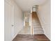 Bright foyer with a staircase and wood-look flooring, offering a welcoming entrance at 2159 Meadow Peak Rd, Duluth, GA 30097
