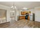 Spacious kitchen featuring stainless steel appliances, wood cabinets, and vinyl floors at 2159 Meadow Peak Rd, Duluth, GA 30097