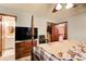 Bedroom with a large bed, dresser, and ensuite bathroom access at 2515 Impala Dr, Cumming, GA 30041