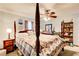 Main bedroom with a four-poster bed and floral bedding at 2515 Impala Dr, Cumming, GA 30041