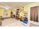 Multi-purpose room with yellow walls and ample storage at 2515 Impala Dr, Cumming, GA 30041