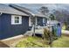 Side view of a charming ranch home with gray siding and deck at 2515 Impala Dr, Cumming, GA 30041