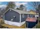 Rear view of a single story home with a shed and small deck at 2515 Impala Dr, Cumming, GA 30041