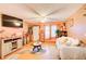 Bright living room with hardwood floors, comfy couch, and large TV at 2515 Impala Dr, Cumming, GA 30041