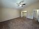 Bright bedroom featuring a walk-in closet and ceiling fan at 5391 Walker Rd, Stone Mountain, GA 30088