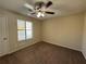 Spacious bedroom with ceiling fan and window at 5391 Walker Rd, Stone Mountain, GA 30088